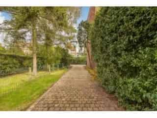 Bouwgrond Kapellen - Halfopen Bewoning - Rustige Straat