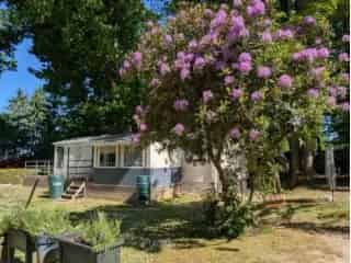 Huis te koop Bever - Stacaravan met 3 slaapkamers en tuin