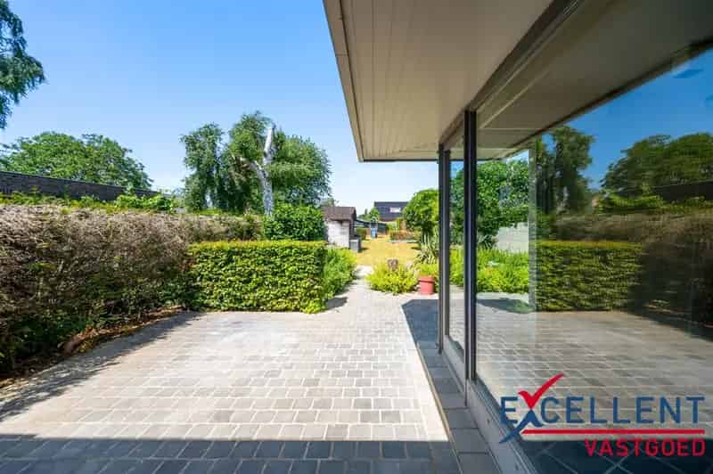 Huis te huur Wetteren: Charmante woning met tuin en handelspand