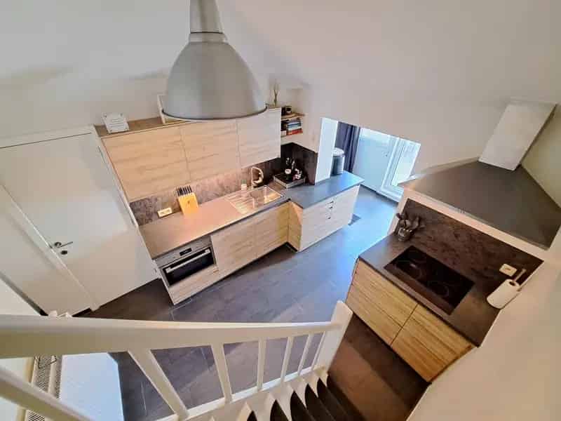Rijwoning te Rekem 2 slaapkamers tuin terras
