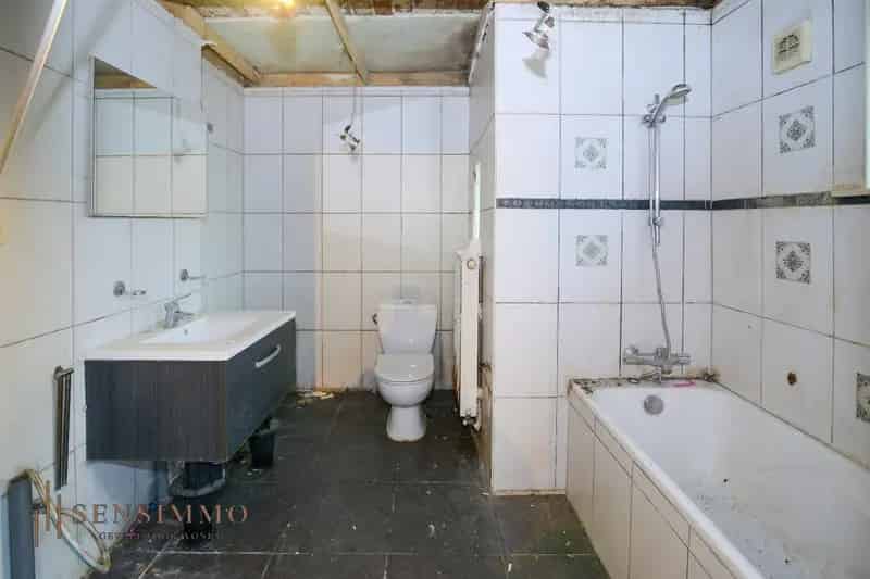 Te renoveren halfopen woning 3 slaapkamers Genk Tuinwijk