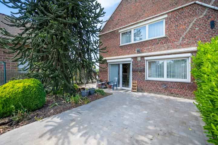 Huis te koop in Dilbeek met potentieel en zonnige tuin