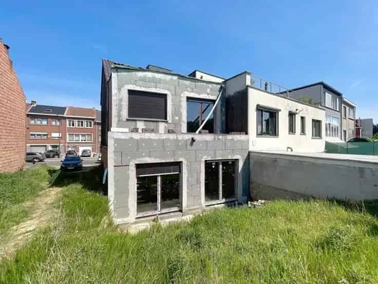 Te renoveren appartementenblok Dilbeek 2 units tuin