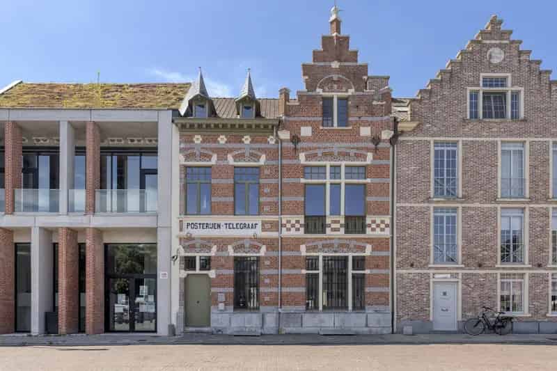 Opbrengsteigendom Rupelmonde: gerenoveerd pand met handelsruimte en appartementen
