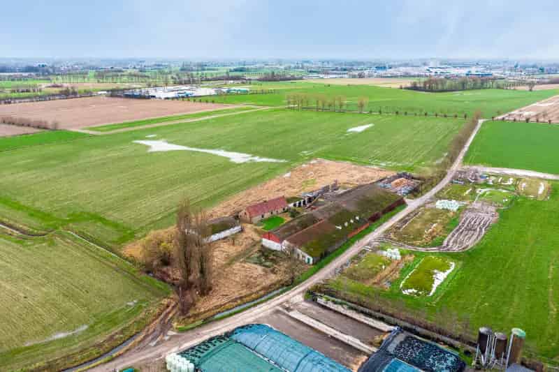 Grond te huur Landegem: Te renoveren hoeve of bouwgrond op 1 hectare