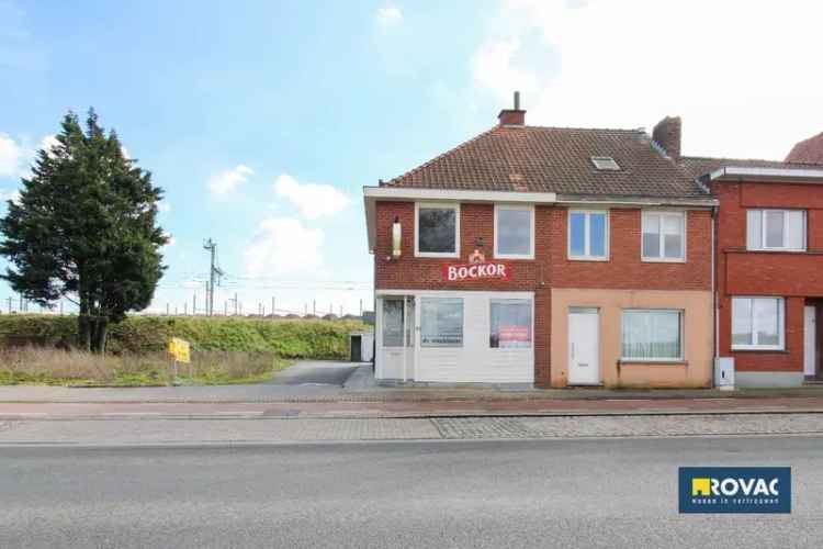 Handelspand met woonst met 3 kamers en garage