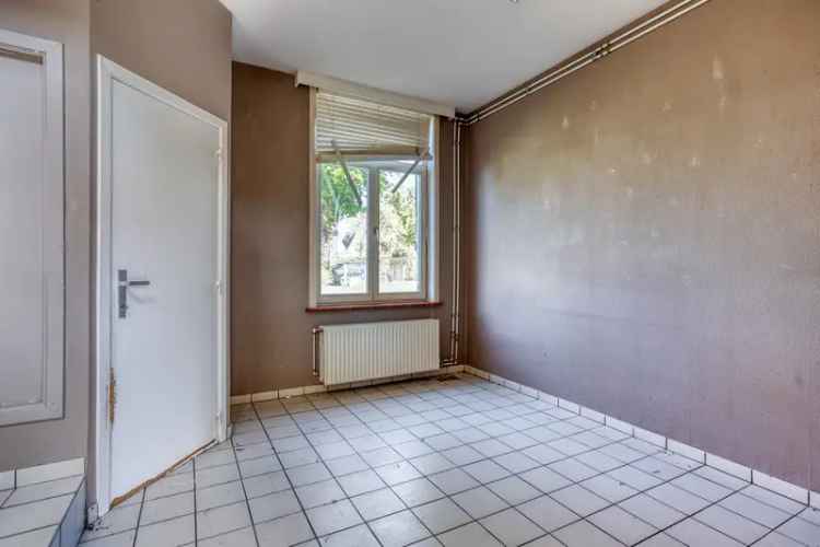 Huis te koop: te renoveren halfopen bebouwing met tuin