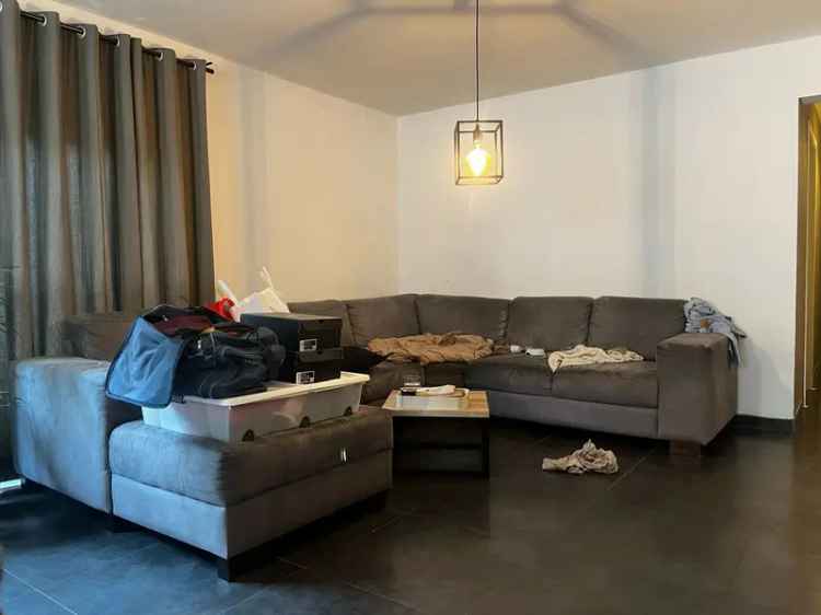 Te koop gelijkvloers appartement in Ham met 2 slaapkamers en tuin