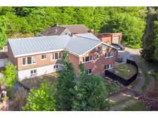 Handelspand met Appartement en Woning te Koop Huldenberg