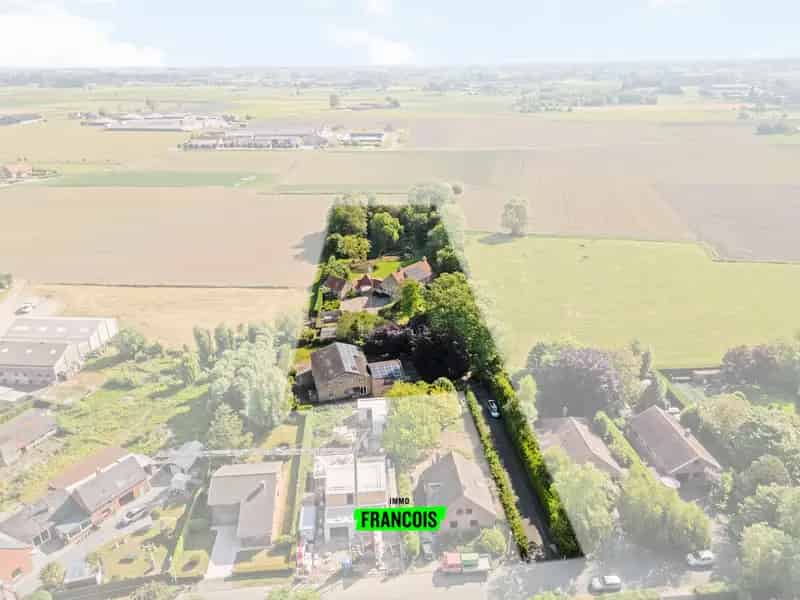 Landhuis met Vakantiewoning en Tuin te Merkem