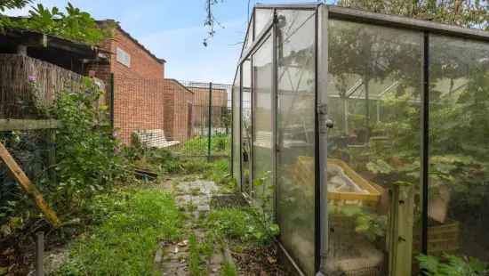 Woning met 5 slaapkamers en tuin op toplocatie in Temse