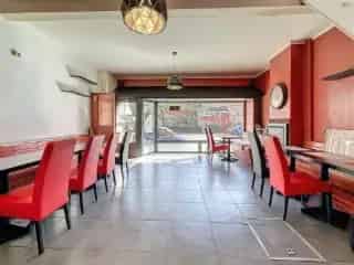 Handelspand te koop Belsele - Pizzeria met magazijn en bovenwoning