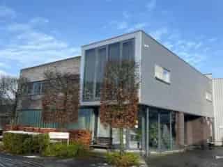 Industrie te koop Olen - Bedrijfsgebouw met Magazijn Kantoren en Conciërgewoning