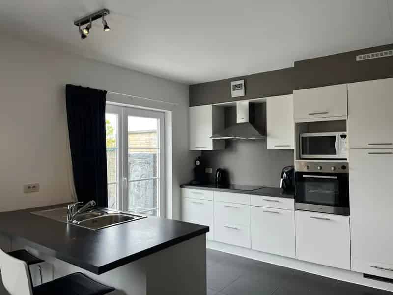 Huis te koop De Haan: Moderne halfopen woning met tuin en garage
