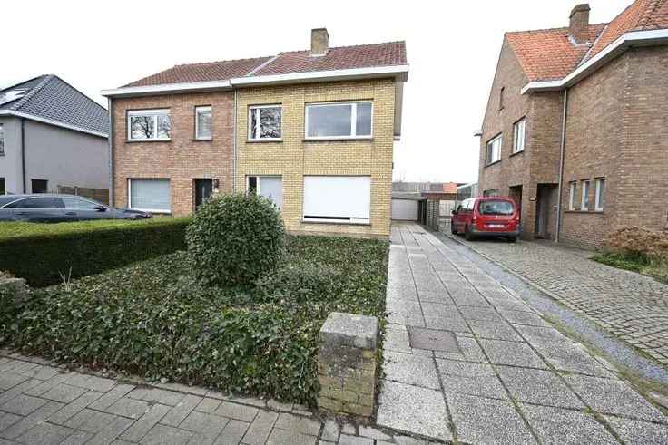 Huis te koop in Sint-Kruis met garage en westelijke tuin