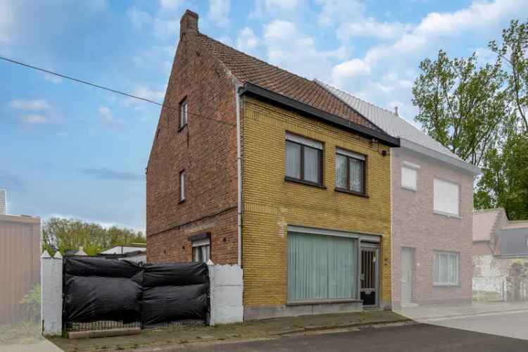 Huis te koop gezinswoning in Evergem met garage en tuin