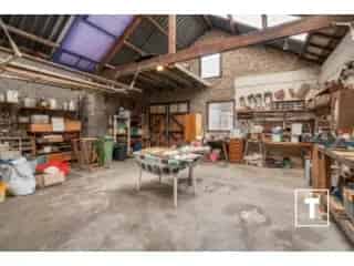 Huis te Koop Gentbrugge - Ruime gezinswoning met garage en loods