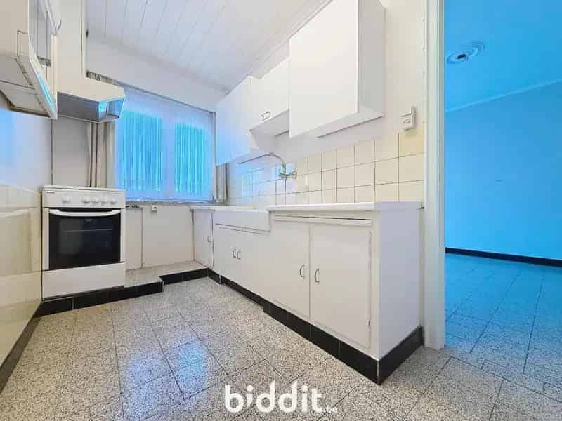 Te renoveren woning met garage en tuin Wetteren