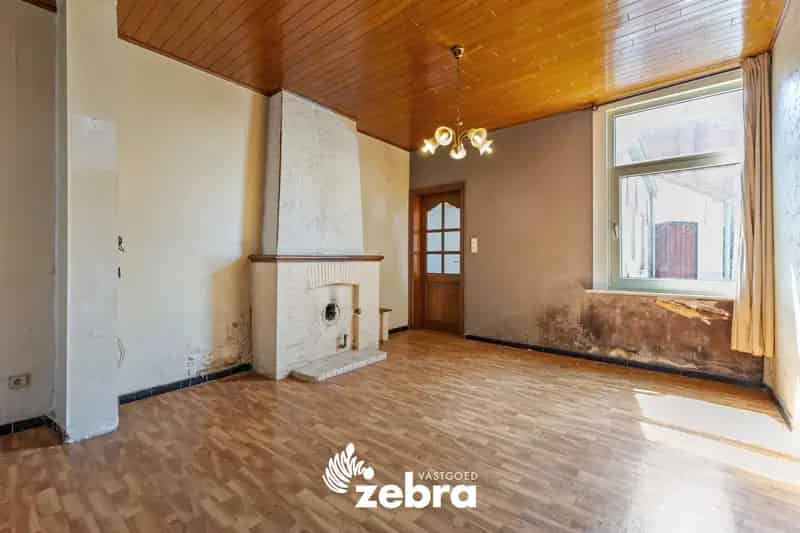 Te renoveren woning met stadskoer in centrum Tielt