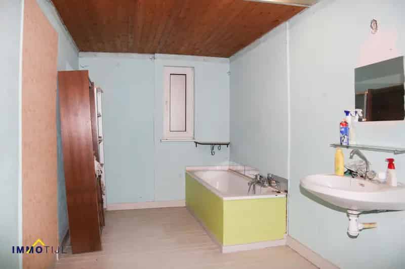 Te renoveren woning met 4 slaapkamers en tuin te Moorsel