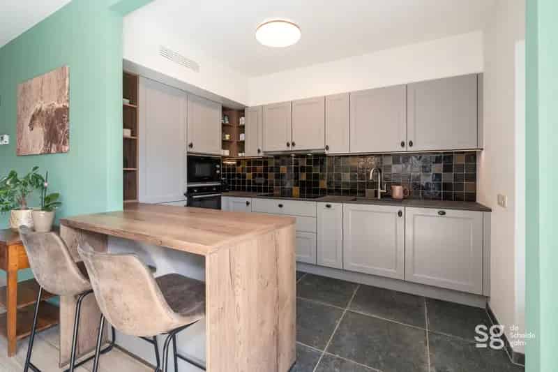 Huis te koop De Pinte: gerenoveerde woning met tuin en garage