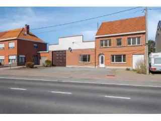 Industrie te koop - Ruime woning met loods en tuin