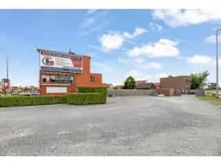 Handelspand te koop Lier - Frituur met appartement en bouwgrond