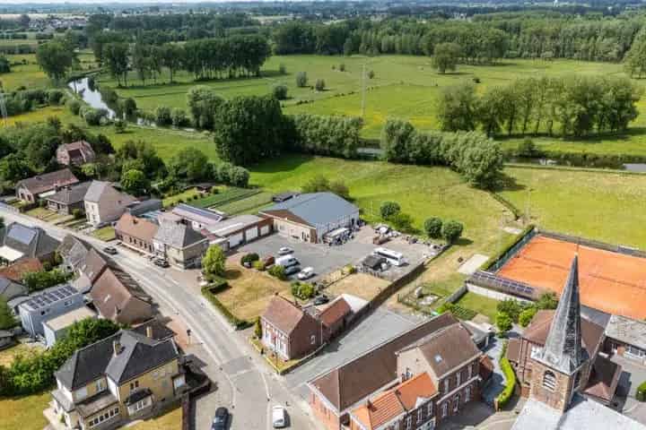 Te renoveren woningen en loods te koop Geraardsbergen