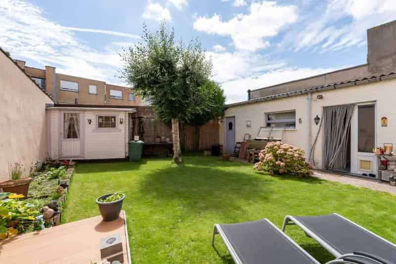 Brede Rijwoning met Garage en Zuidgerichte Tuin Heist