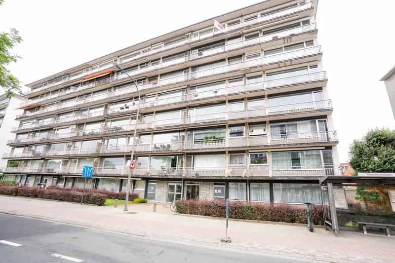 Appartement te koop met tuin en garagebox