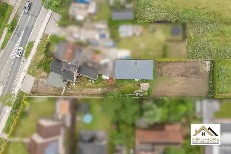 Bouwgrond met woning en magazijn te Kalken