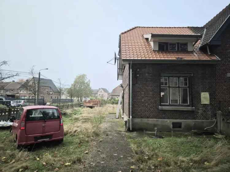 Karaktervolle tuinwijkwoning te koop in Genk: Maak uw droomproject waar!