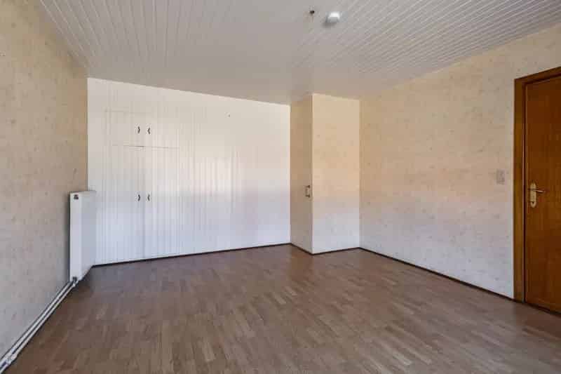Te renoveren woning met garage en ruime tuin nabij Dessel centrum