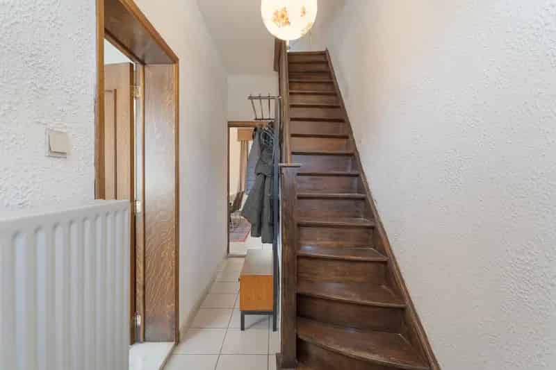Te renoveren woning met bouwgrond te Bree