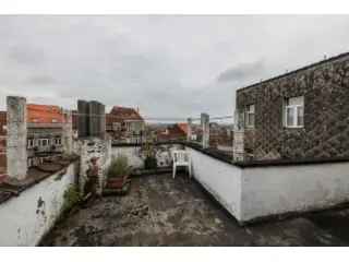 Duplex kopen appartement in Vorst met terras en mogelijkheden