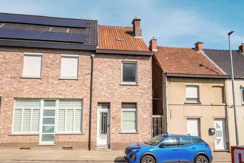 Op te frissen woning met 2 a 3 slaapkamers en tuin te Buizingen