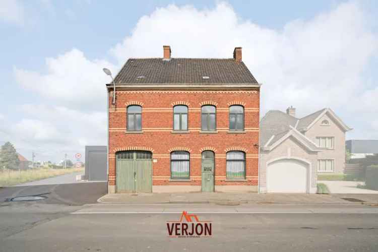 Te koop ruime woning met garage en werkplaats