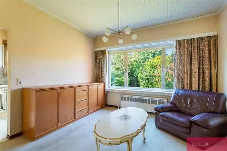 Huis te koop Merksem: Halfopen woning met tuin en garage
