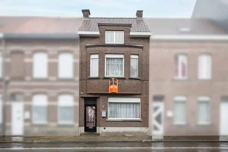 Woning met tuin en perceel oprit garage
