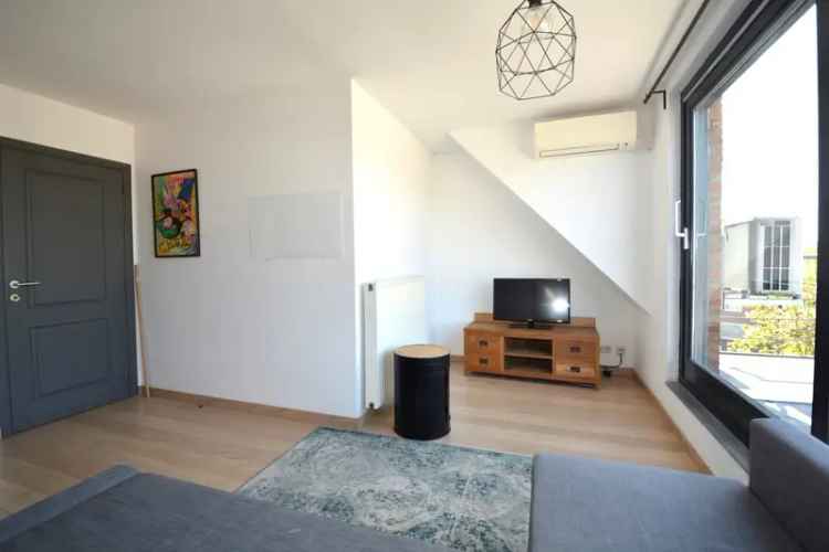 Dakappartement te koop Wommelgem 1 slaapkamer ruim terras