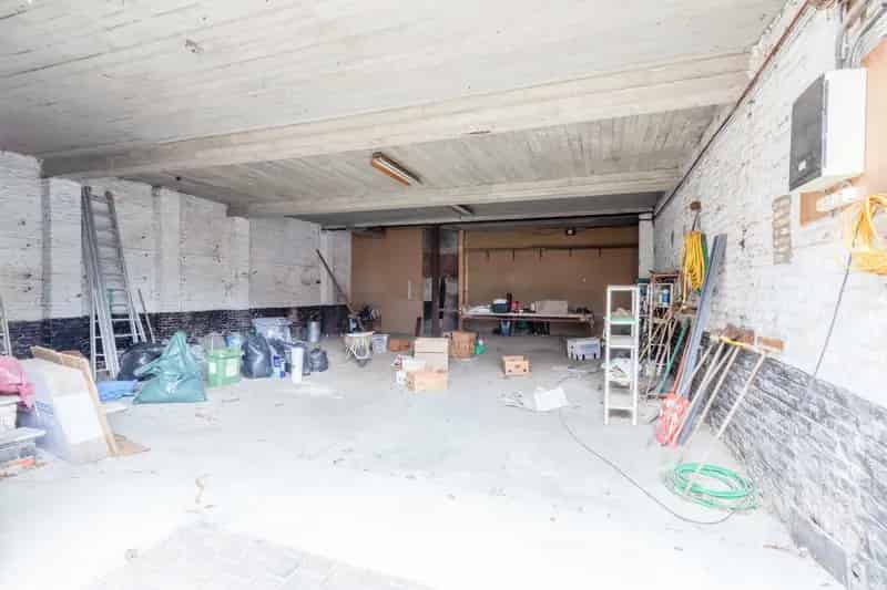 Magazijn met bovenverdieping praktijkruimte en herenhuis
