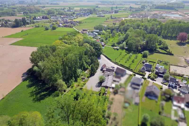 Grond te koop: 2 halfopen bebouwingen, grote tuin, landelijk gelegen