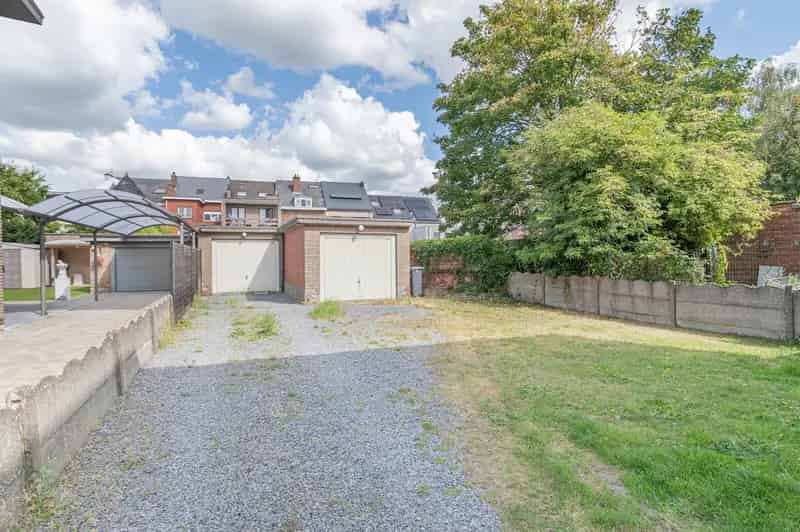Opbrengsteigendom met 2 appartementen, tuin & garage