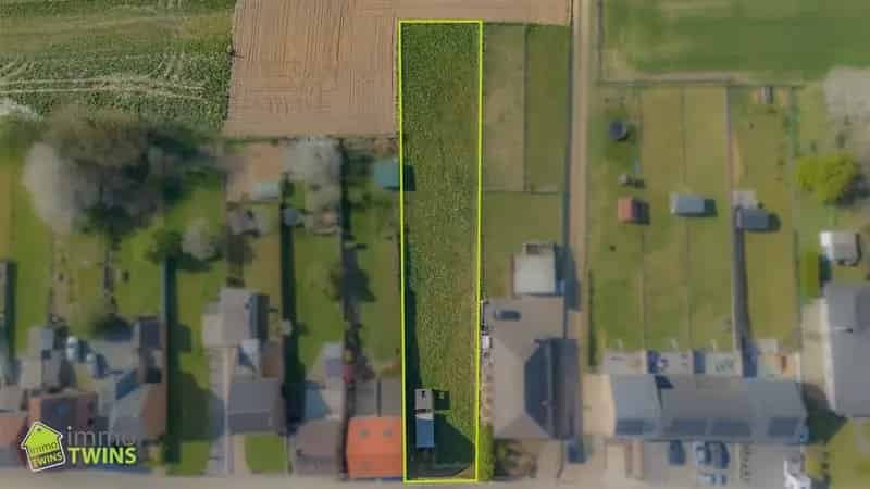 Bouwgrond Ninove: Ruime kavel met groenzicht, halfopen bebouwing