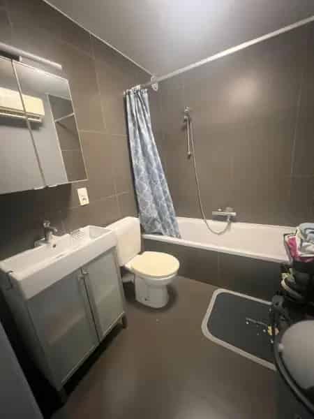 Appartement te koop Sint-Niklaas - Minimalistisch gelijkvloers appartement