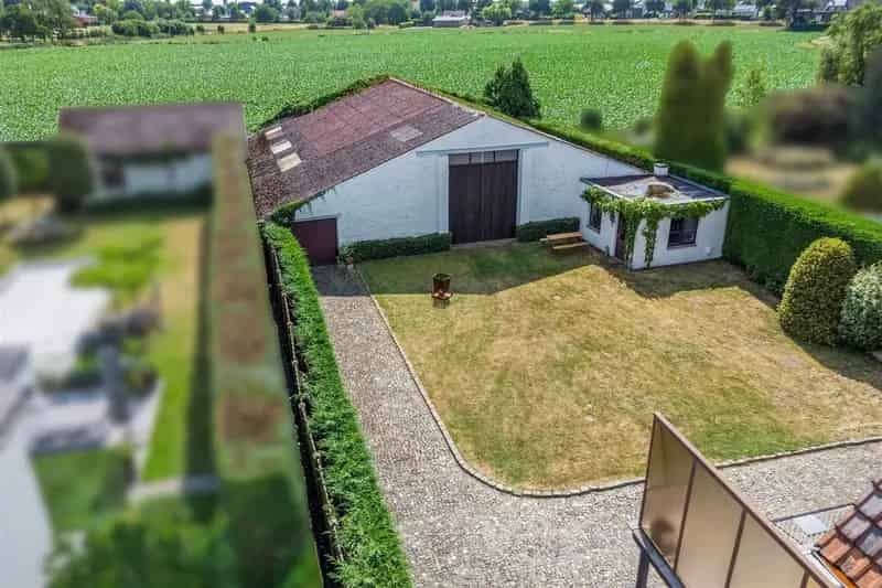 Grond te huur Aldeneik: 11a42ca Perceel met Woning en Loods